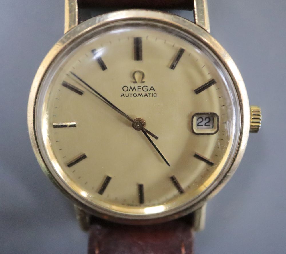 A gentlemans 1970s 9ct gold Omega automatic wrist watch, movement c.1012, movement no. 38167699, on associated strap,